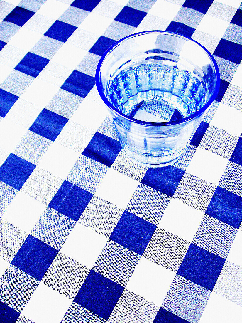 Beverage, Beverages, Blue, Blue tone, Checkered, Chequered, Clean, Color, Colour, Drink, Drinks, Empty, Glass, Glasses, Monochromatic, Monochrome, Object, Objects, One, One item, Still life, Table, Tablecloth, Tablecloths, Tables, Thing, Things, Toned, L5