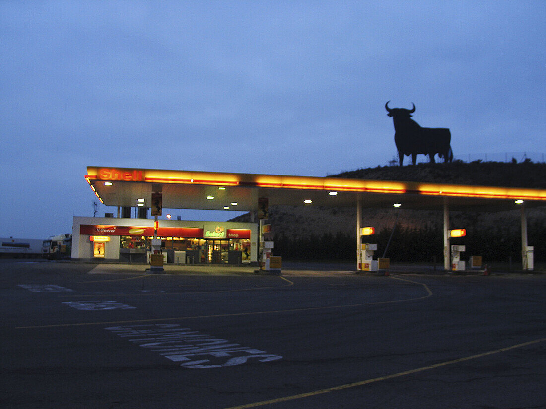 Gas station and Osborne bull. Navarre, Spain