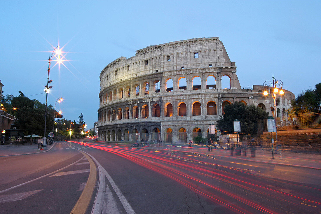 Via dei Fori Imperiali. Night view of the Colosseum in Rome. Italy