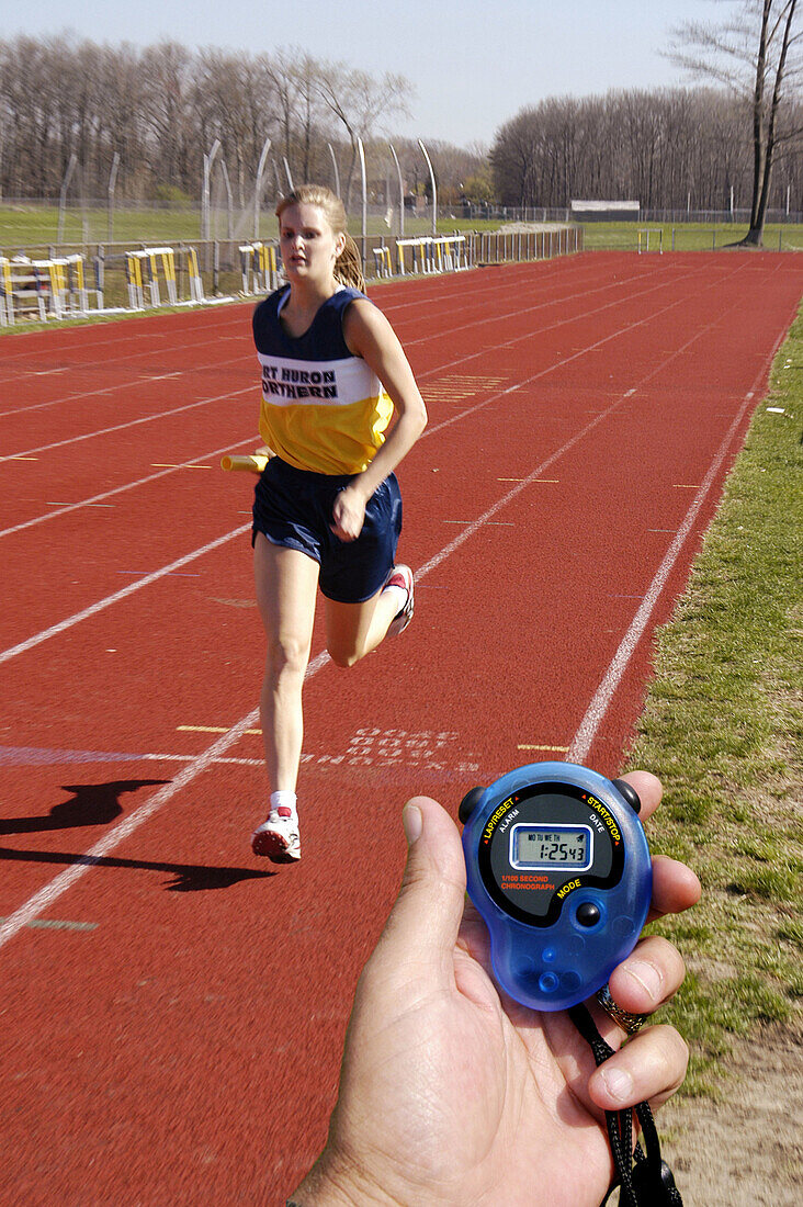 Hand held digital stop watch which is used to time runners during a track and field event