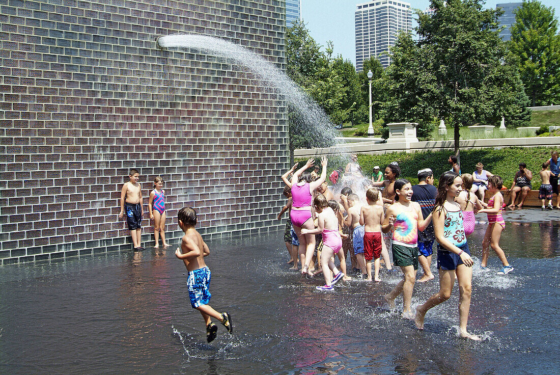 Water fountains at Millennium Park in downtown Chicago provide a fun atmospere for children. Chicago, Illinois. USA.