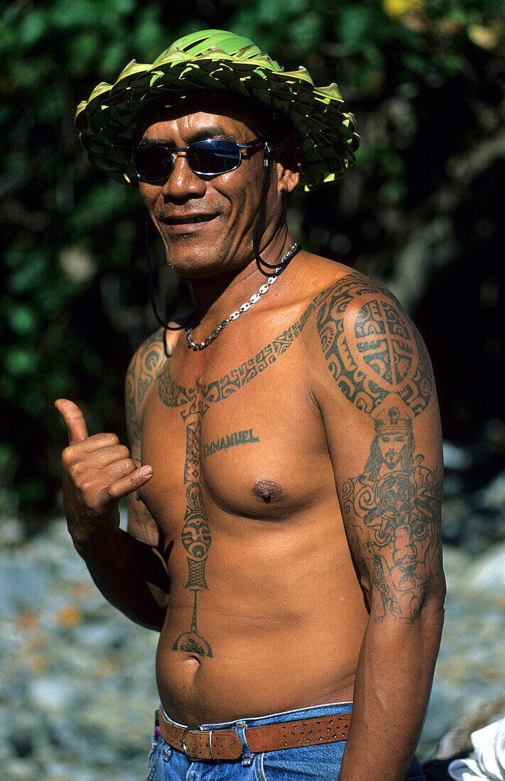 A Polynesian with traditional tattoos in the village of Hakahetau on the island of Ua Pou, French Polynesia