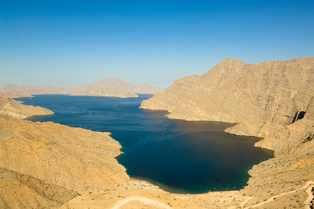 Fjord in the Haijar Mountains with mountain road, Kashab, Khasab, Musandam, Oman