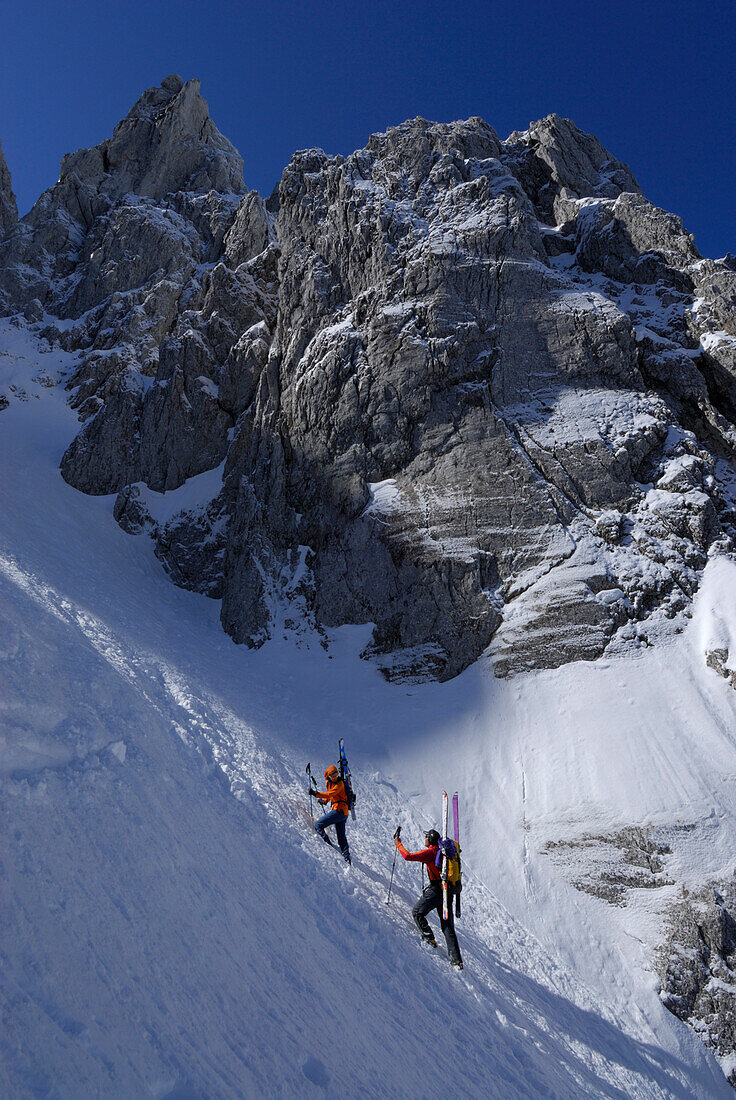 Two backcountry skiers ascending, Griesner Kar, Wilder Kaiser, Kaiser range, Tyrol, Austria