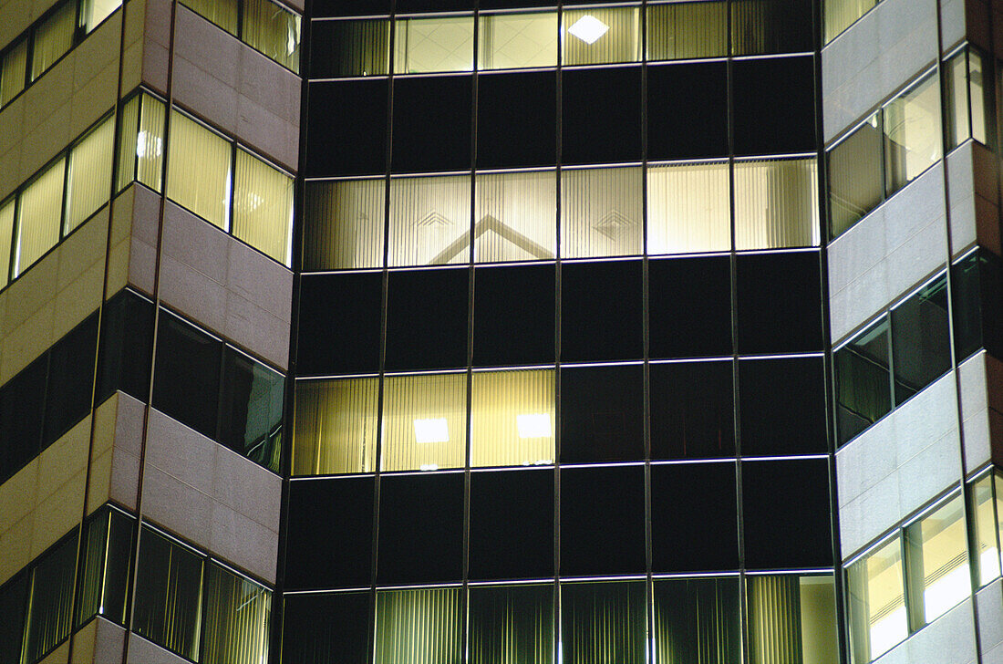 Lit windows in office buildings. New York City, USA