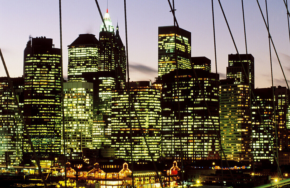 Nighttime view from the Brooklyn Bridge on Lower Manhattan skyline. New York City, USA