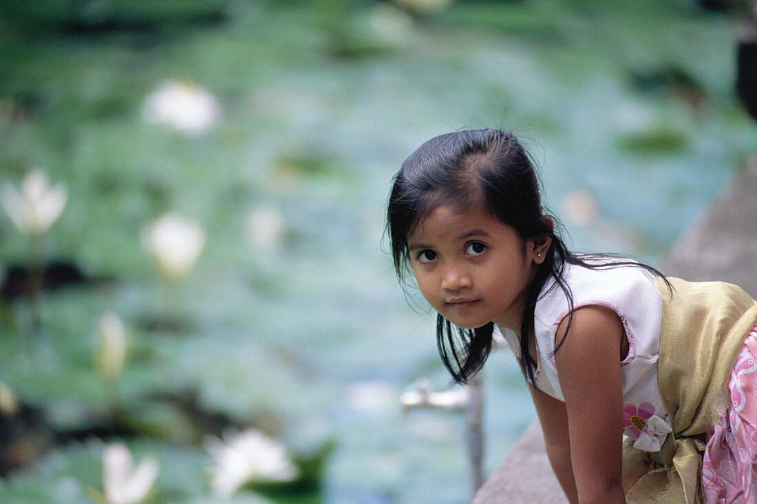 Native girl in Jagat Natha Temple. Bali, Indonesia