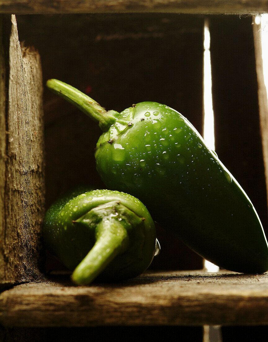 Jalapeño peppers in old wood crate