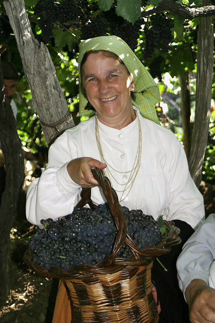 Woman in traditional costume. Festas das Vindimas (grape harvest festival). Estreito da Camara de Lobos. Madeira. Portugal.