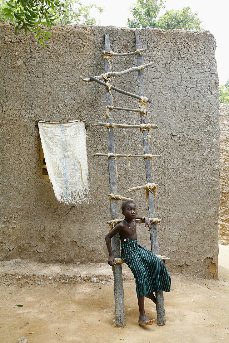 Bozo child in front of his house, Bani River near Mopti. Mali
