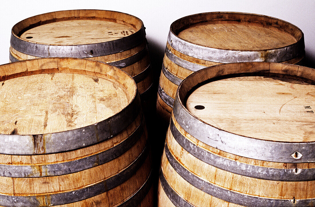 Four large wooden barrels from vineyard used for storing and aging wine