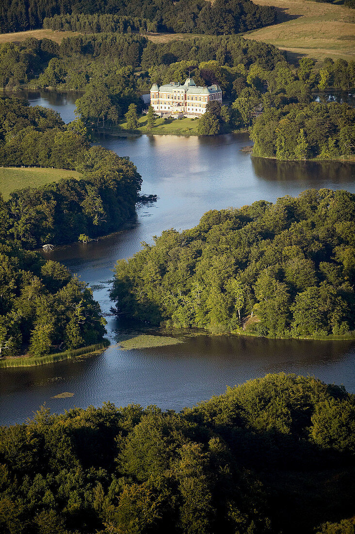 Old castle and lake, aerial view. Häckeberga. Skåne. Sweden.