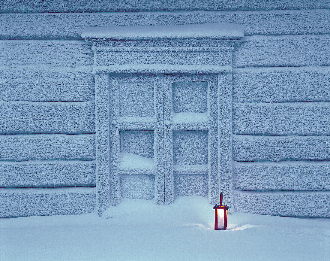 Timber house at candle light. Ranua. Finland.