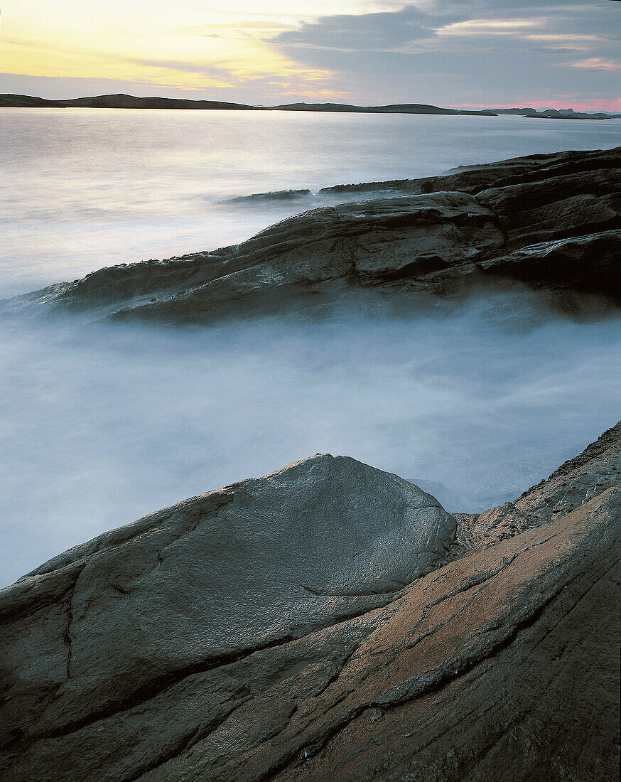 Coasts, stone seashore, morning light. Sanna. Traena. Norway.