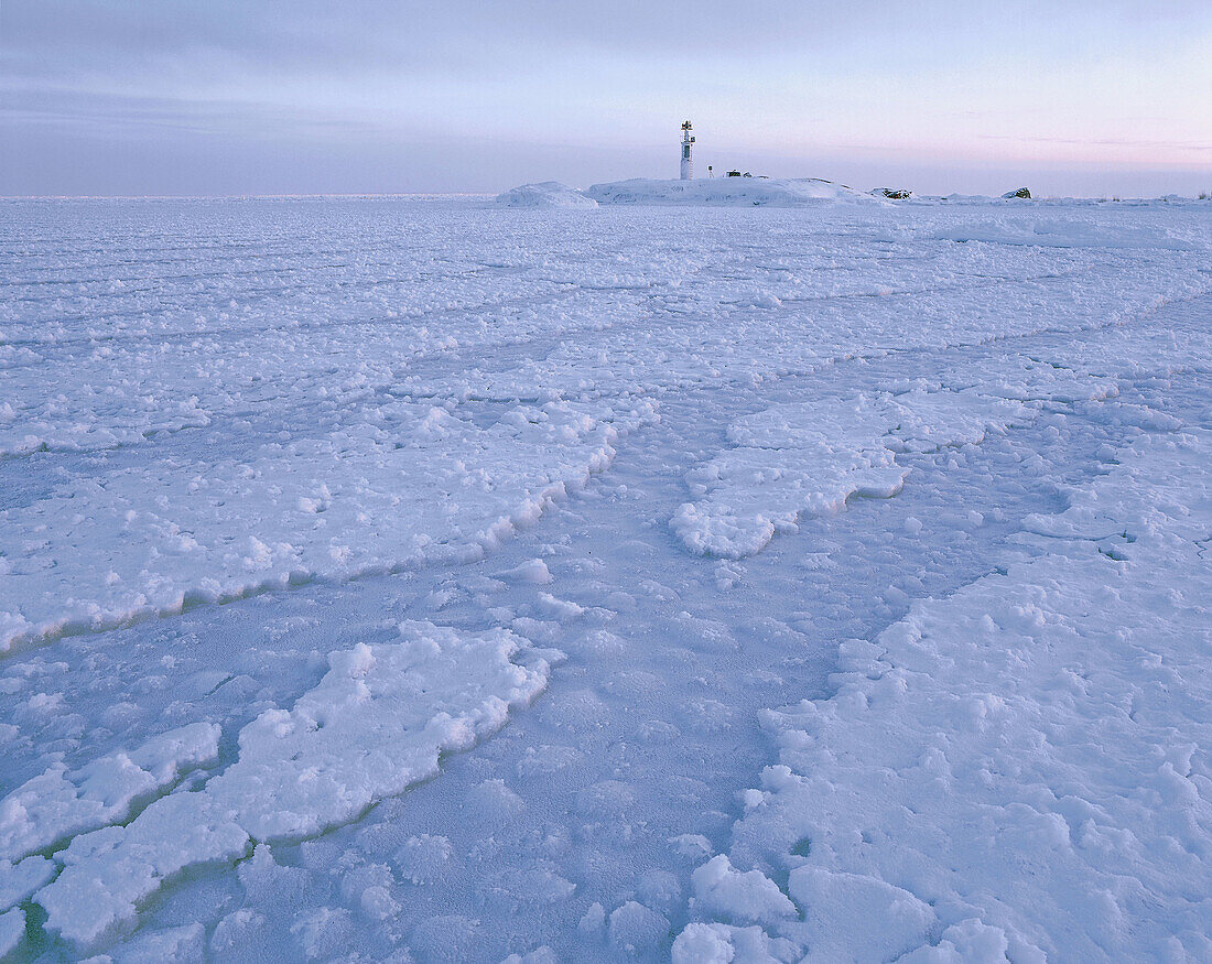 Light house, winter sea, ice formation, Gulf of Bothnia, morning light. Skellefteå. Västerbotten. Sweden.