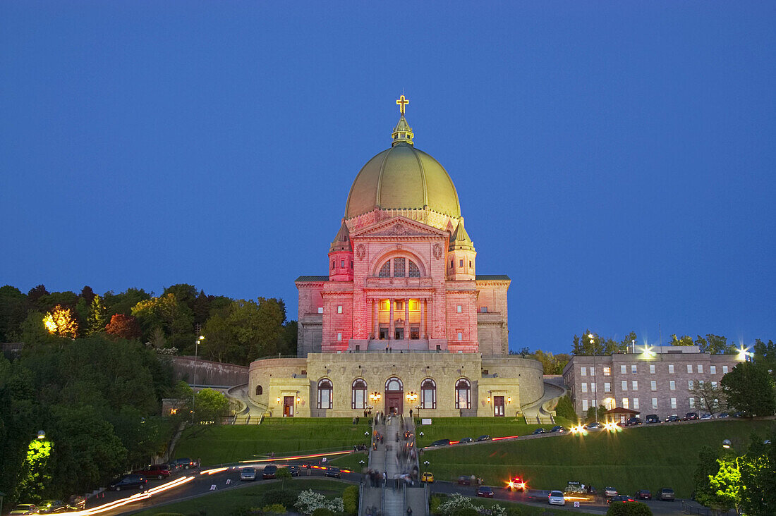 St-Josephs Oratory (Oratoire St-Joseph) after 9PM mass. Trails belong both to car traffic leaving the Oratory and worshippers holding votive candles. Montreal. Quebec, Canada