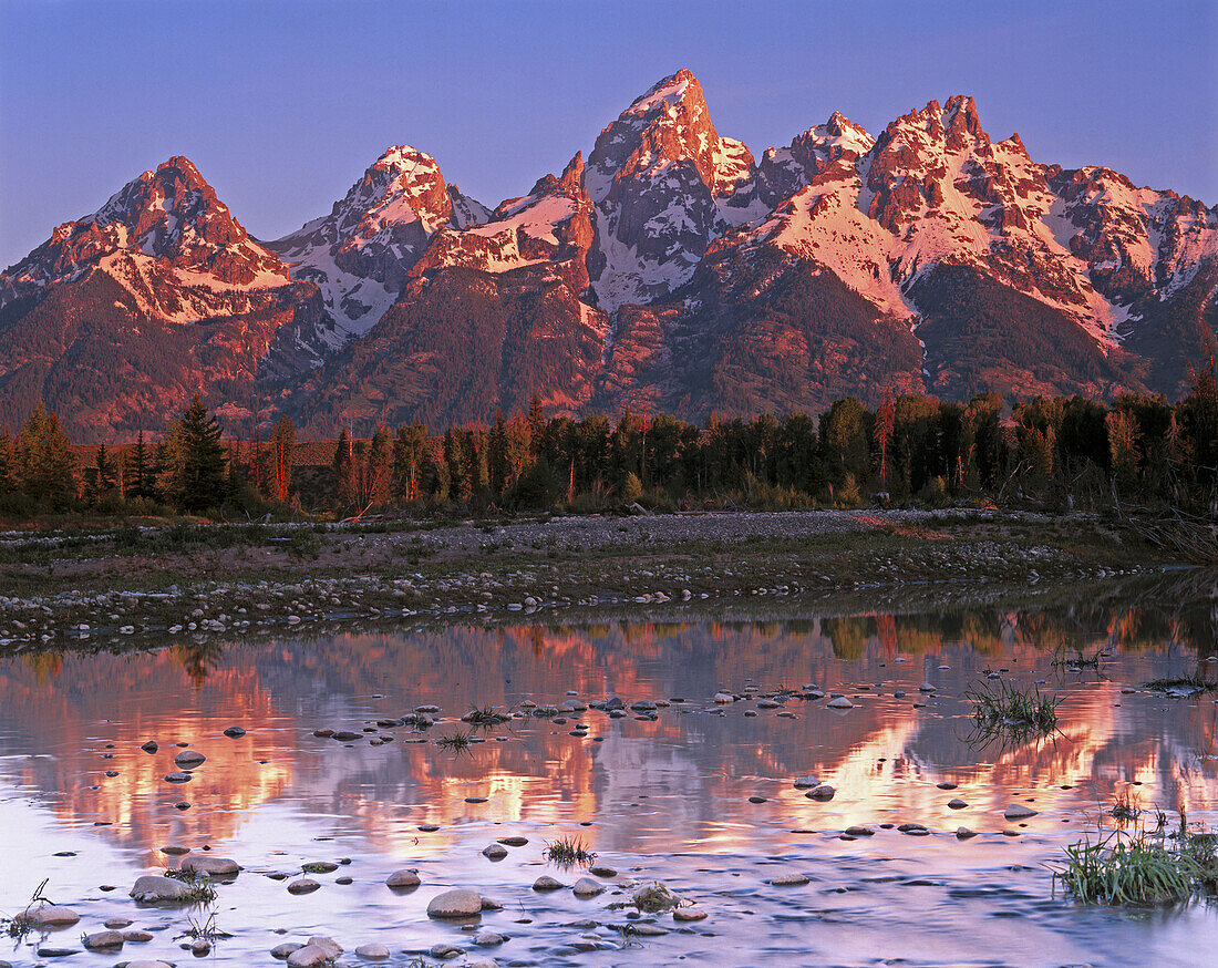 Morning light over the Teton Range reflected in the Snake River. Grand Teton National Park. Wyoming. USA