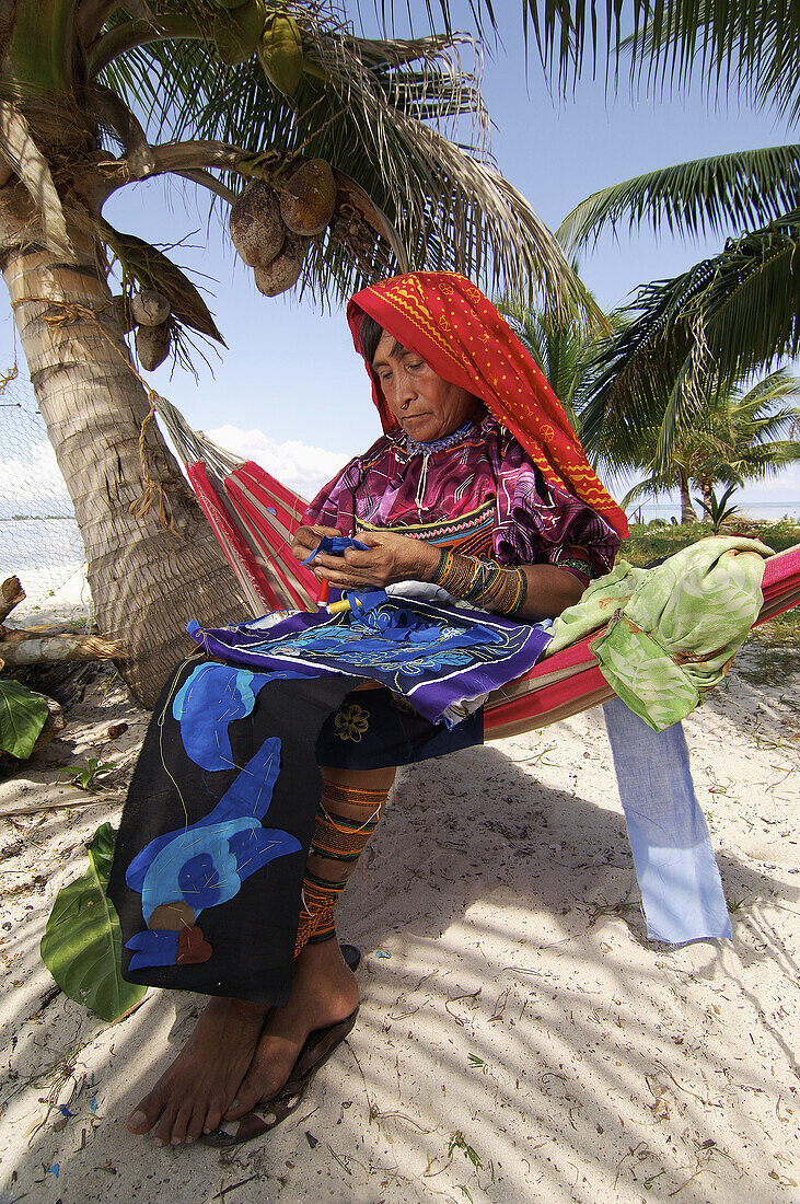 Kuna indian Woman to sew a Mola (traditional dress). San Blas Islands, Panama.