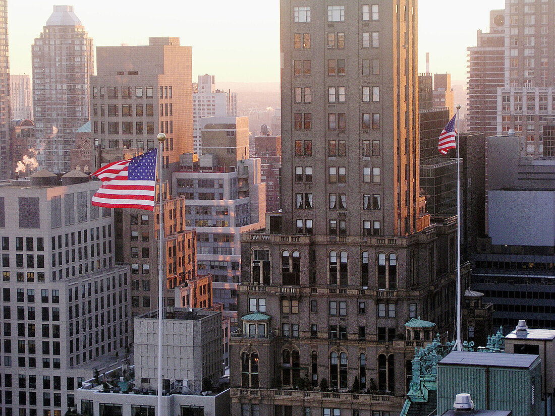 New York, NY: A flag waves in the early morning light of midtown Manhattan.
