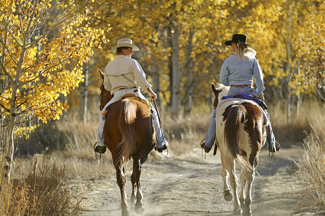 Couple horseback riding near Sun Valley, Idaho. USA