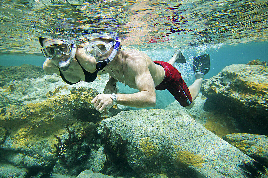 Couple snorkeling on Colombier Beach, St. Barts