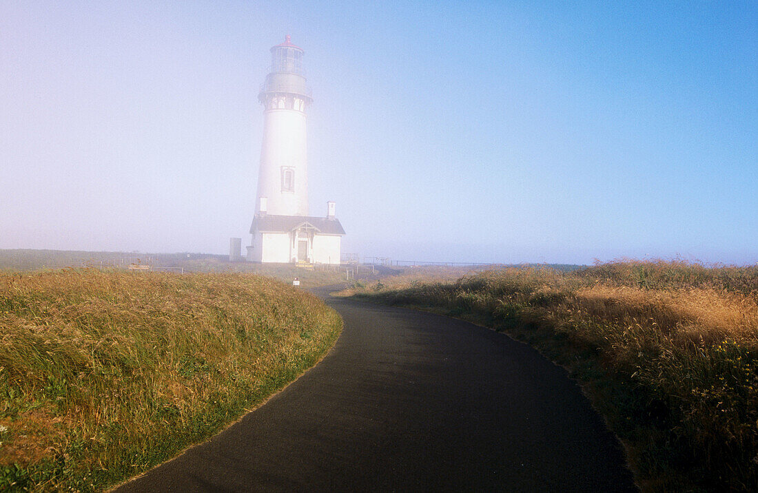 Fog. Yaquina Head lighthouse. Oregon coast. USA.