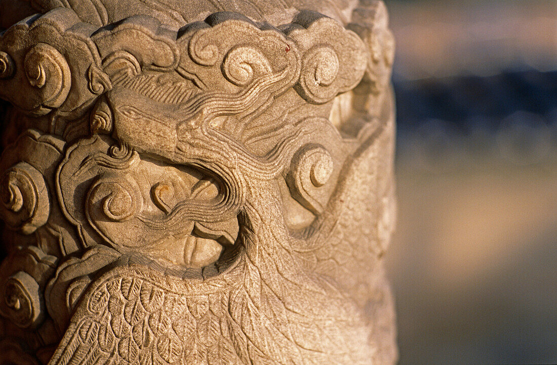 Phoenix with clouds carved on a rock column. Temple of Heaven. Beijing. China