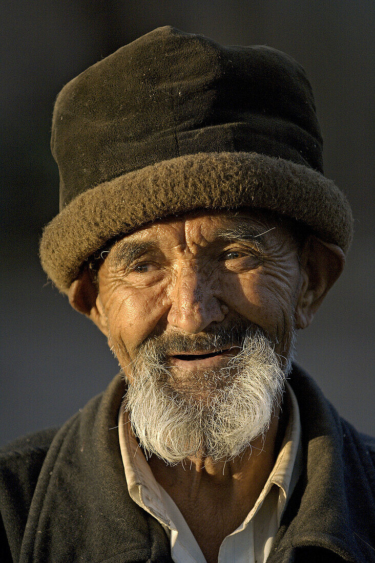a portrait of an senior uigur man. kashgar. xinjiang. china. asia.