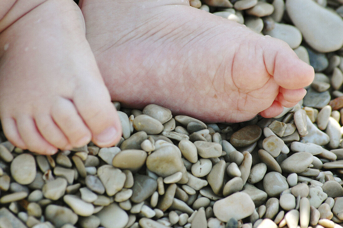 Baby Feet in Pebbles on Beach