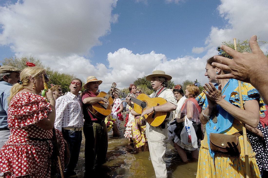 Pilgrims singing prayers in Guadiamar river. Quema river ford. El Rocío road. Vado del Quema. Huelva province, Andalusia, Spain