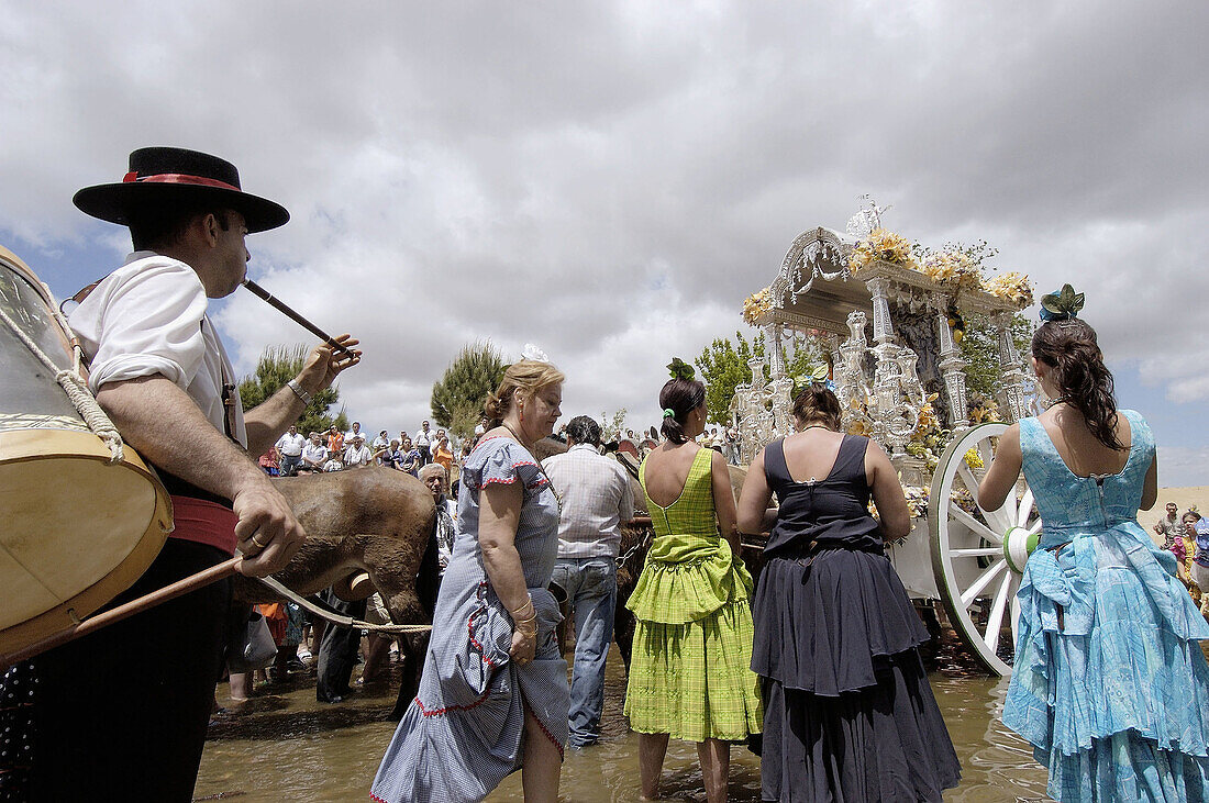 Pilgrims singing prayers in Guadiamar river. Quema river ford. El Rocío road. Vado del Quema. Huelva province, Andalusia, Spain