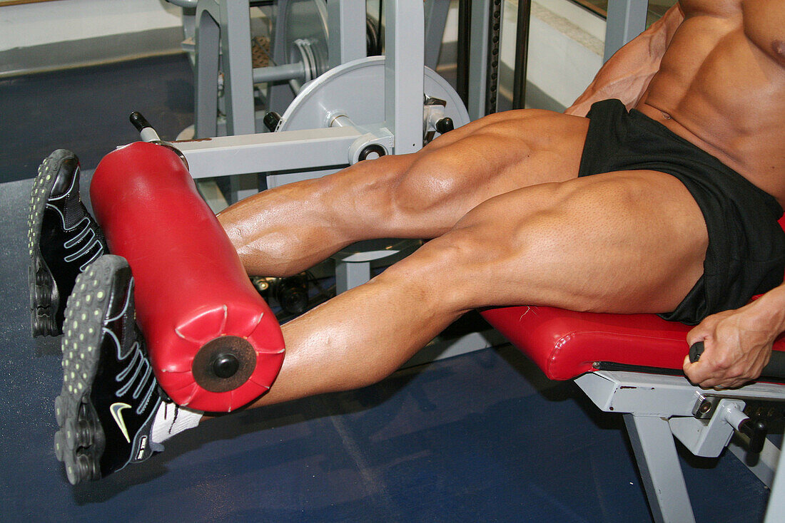 2004 Mr. Universe doing leg curls in training, Abu Dhabi, United Arab Emirates.