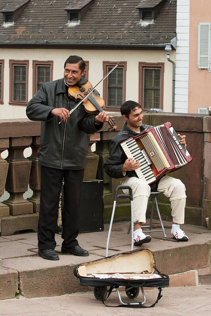 Musicians on the bridge over the River Neckar, Heidelberg, Germany