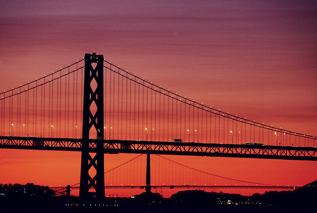 Bay Bridge and Golden Gate Bridge at sunset. California, USA