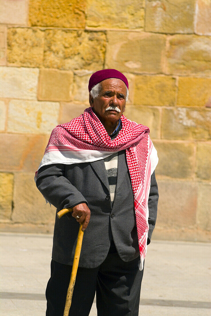 Man walking past the Bab el Bahr (Porte de France) in Place de lIndependance, the entrance of the Medina in Tunis, Tunisia