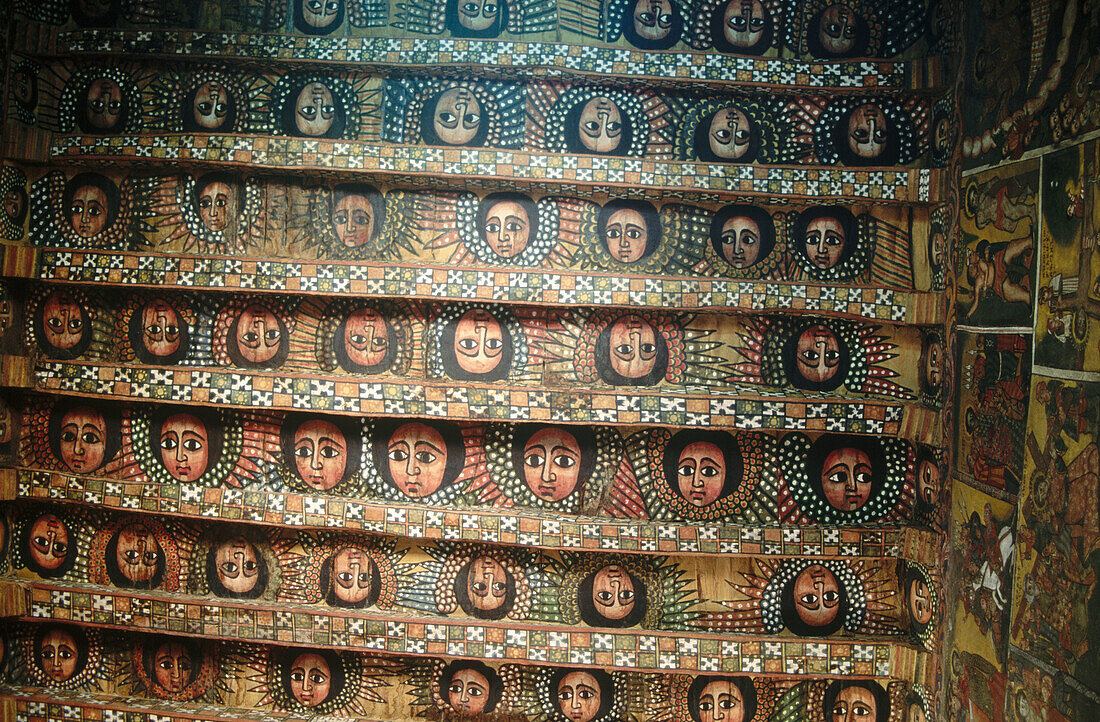 Angels looking down from the ceiling of Debra Berhan Selassie, a hilltop church in Gondar, Ethiopia