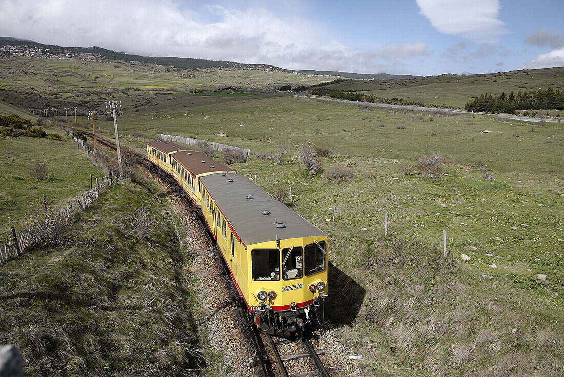 Le Train Jaune. Near Odeillo Font-Romeu Station. Villefranche-de-Conflent, Languedoc-Roussillon, France.