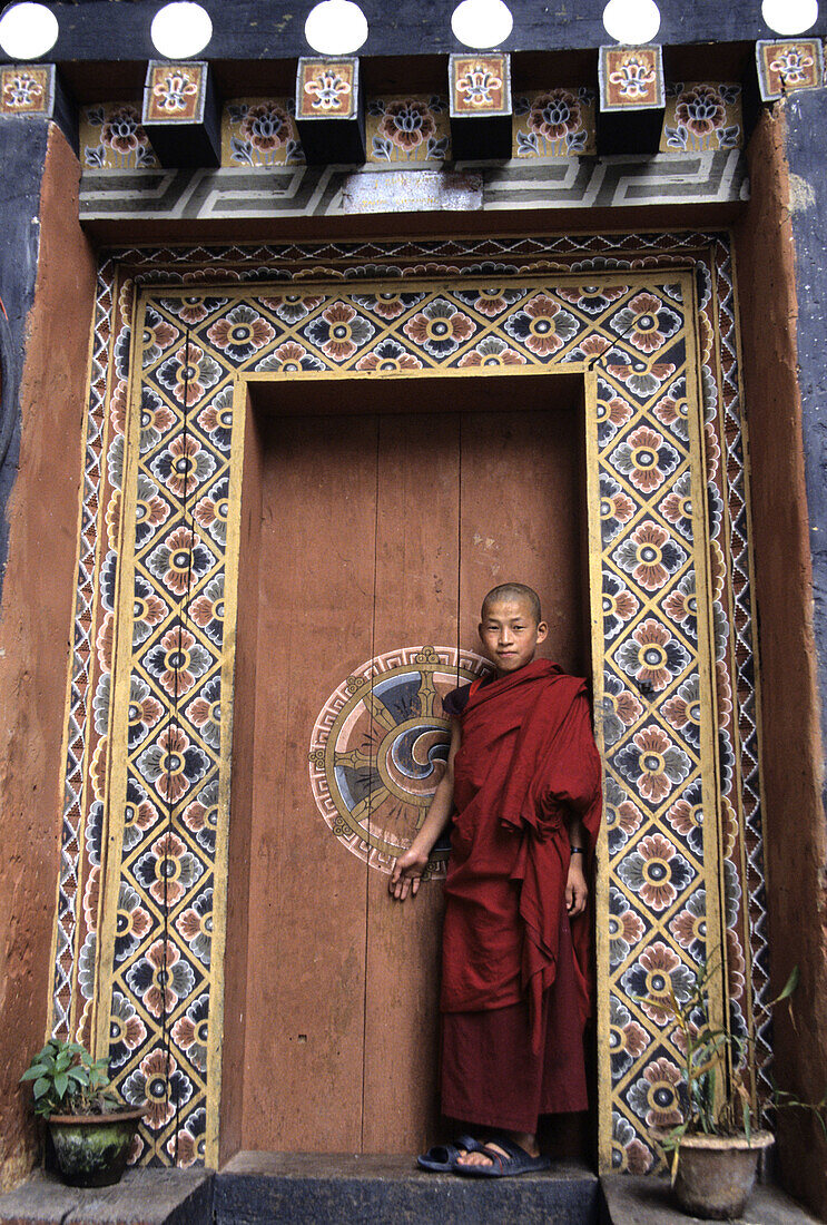 Young monk in doorway