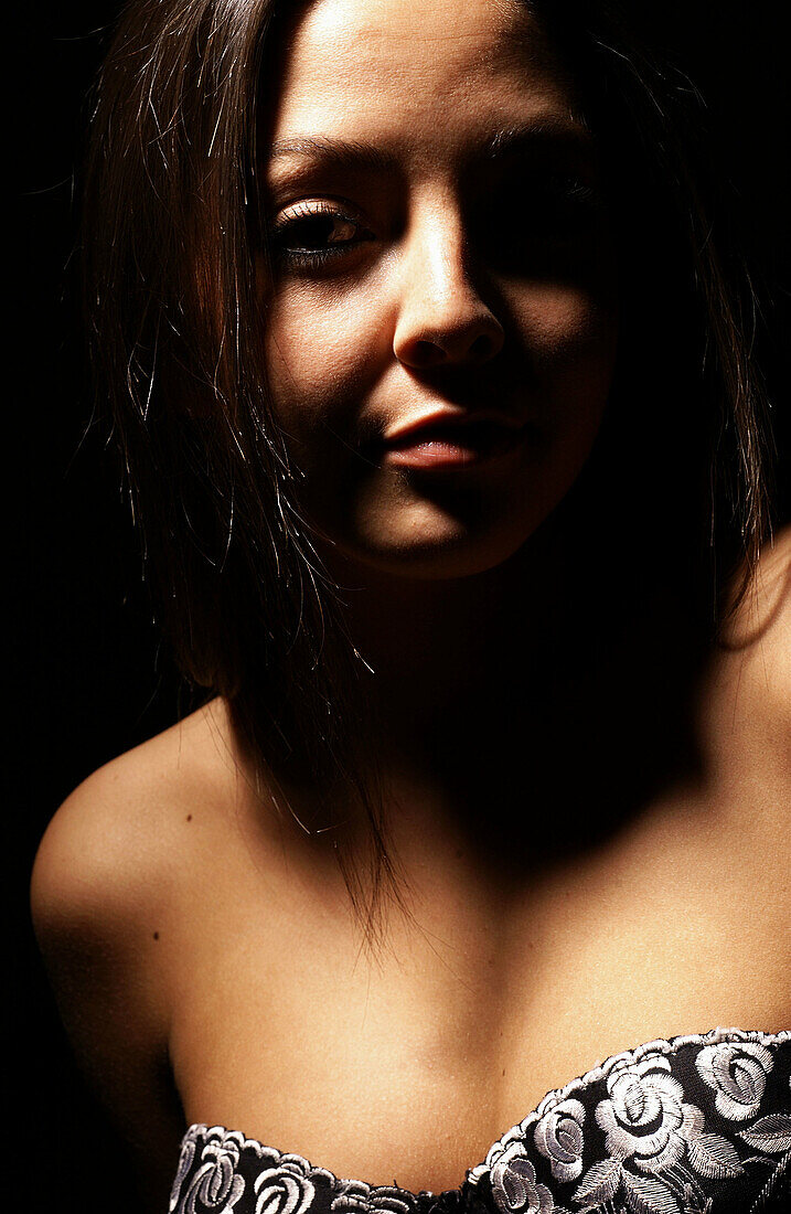 Model with dramatic lighting