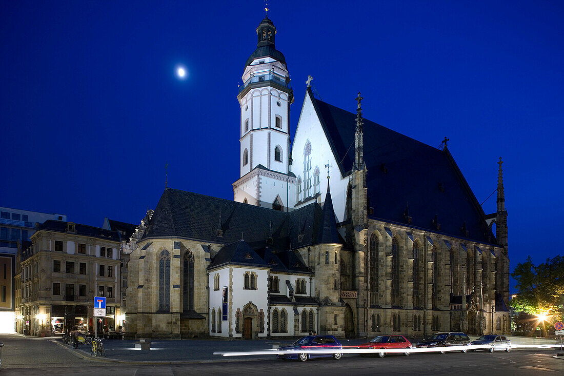 View at the illuminated St. Thomas Church at night, Leipzig, Saxony, Germany, Europe