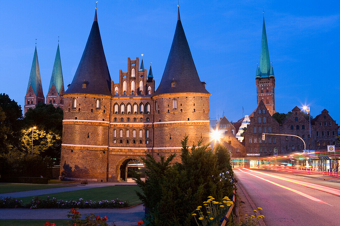 Holstentor (Holsten Gate), St. Mary's Church and St. Peter church at night, Lubeck, Schleswig-Holstein, Germany
