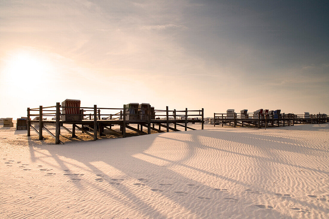 Beach chairs on the beach at sunrise, St. Peter Ording, Eiderstedt peninsula, Schleswig Holstein, Germany, Europa