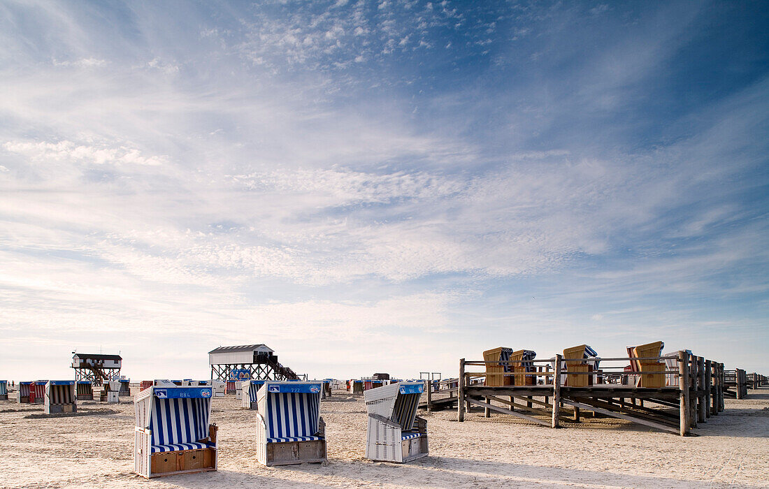 Beach chairs on the beach under clouded sky, St. Peter Ording, Eiderstedt peninsula, Schleswig Holstein, Germany, Europe