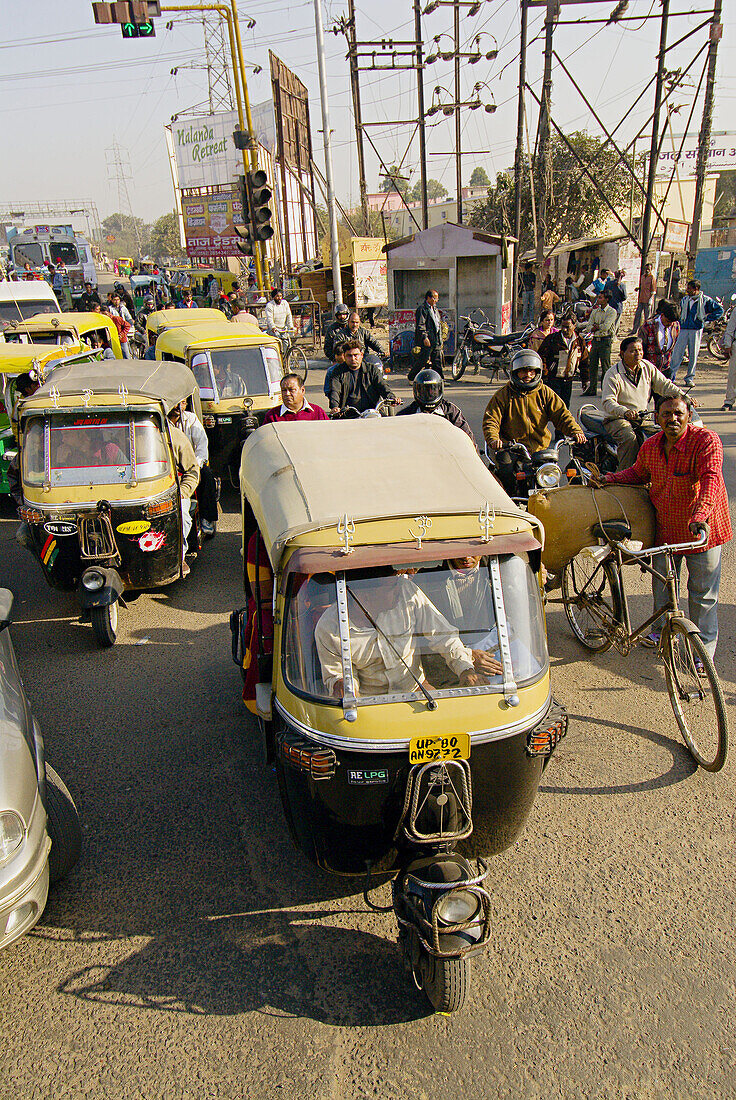 Congested street scene with motorcycle rickshaws (tuk tuks), Agra, Uttar Pradesh, India