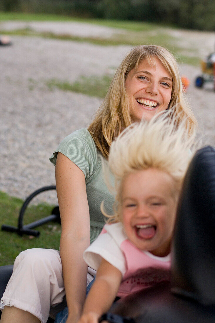 Mother and daughter on a seesaw