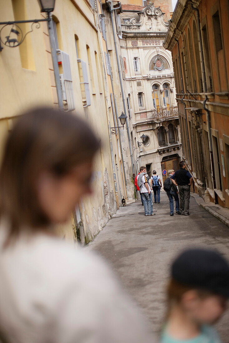 Mother and child walking down a small alley in the old town of Grasse, Cote d'Azur, Provence, France