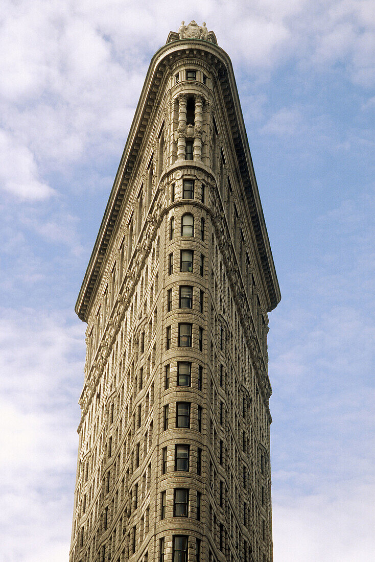 The Flatiron (architect Daniel Burnham, 1902) building on 23rd Street and 5th Avenue in New York City looking straight up from 23rd, NYC. USA (Spring, 2005)