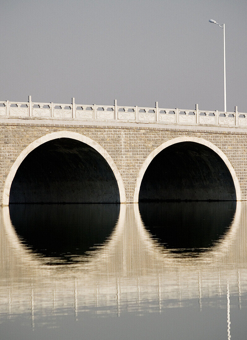 Arched bridge section. Two arches can be seen in the bridge.