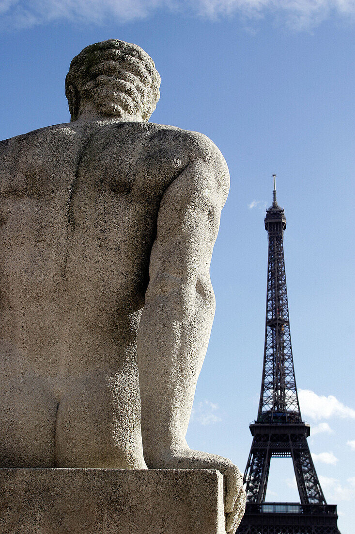 A stone statue of Trocadero with Eiffel Tower in the background, Paris, France