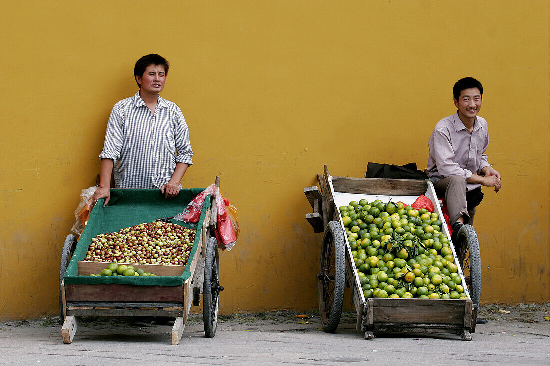 Two local fruit sellers in Suzhou, Jiangsu Province, China